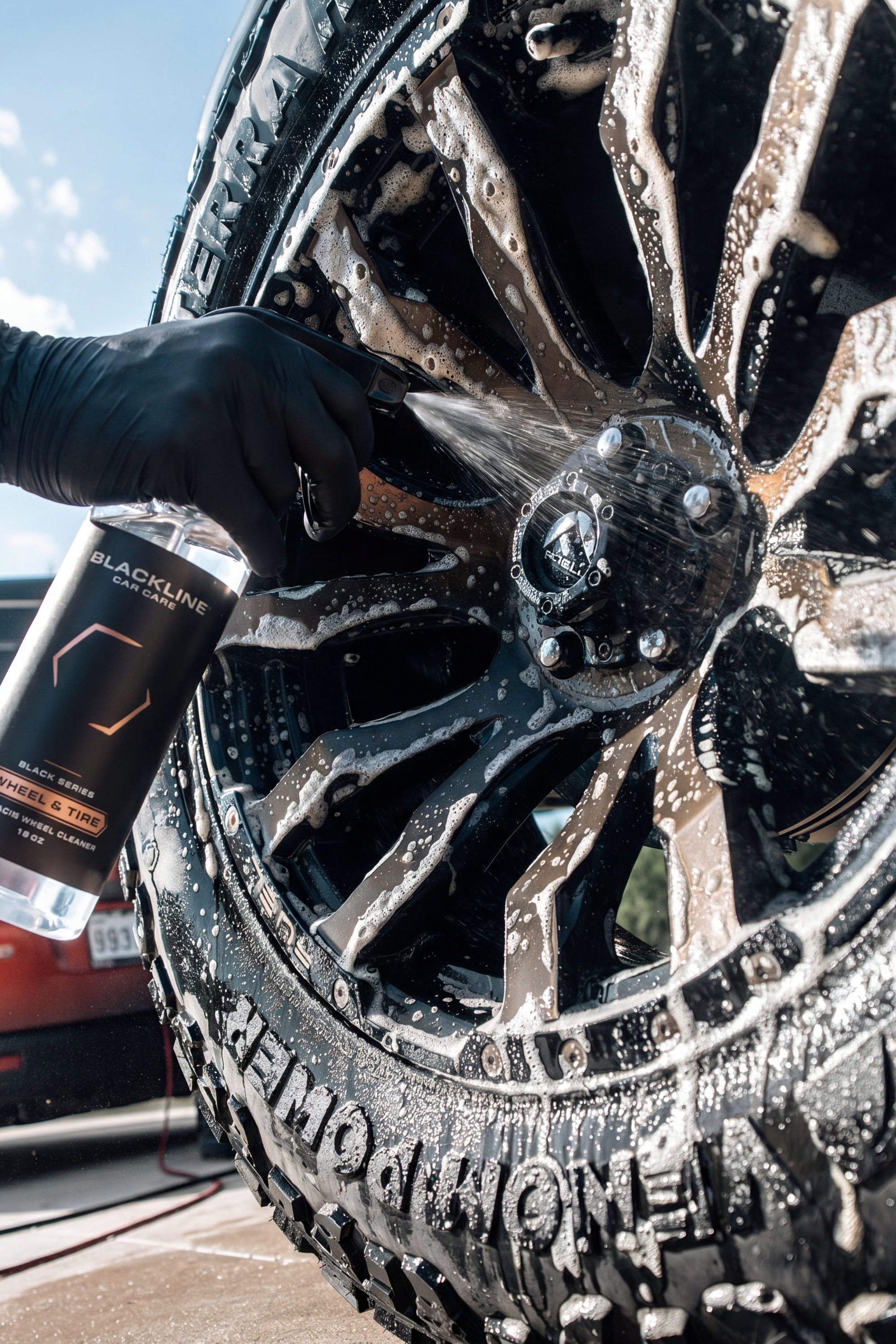 Wheel cleaner foaming and reacting with brake dust on a wheel.