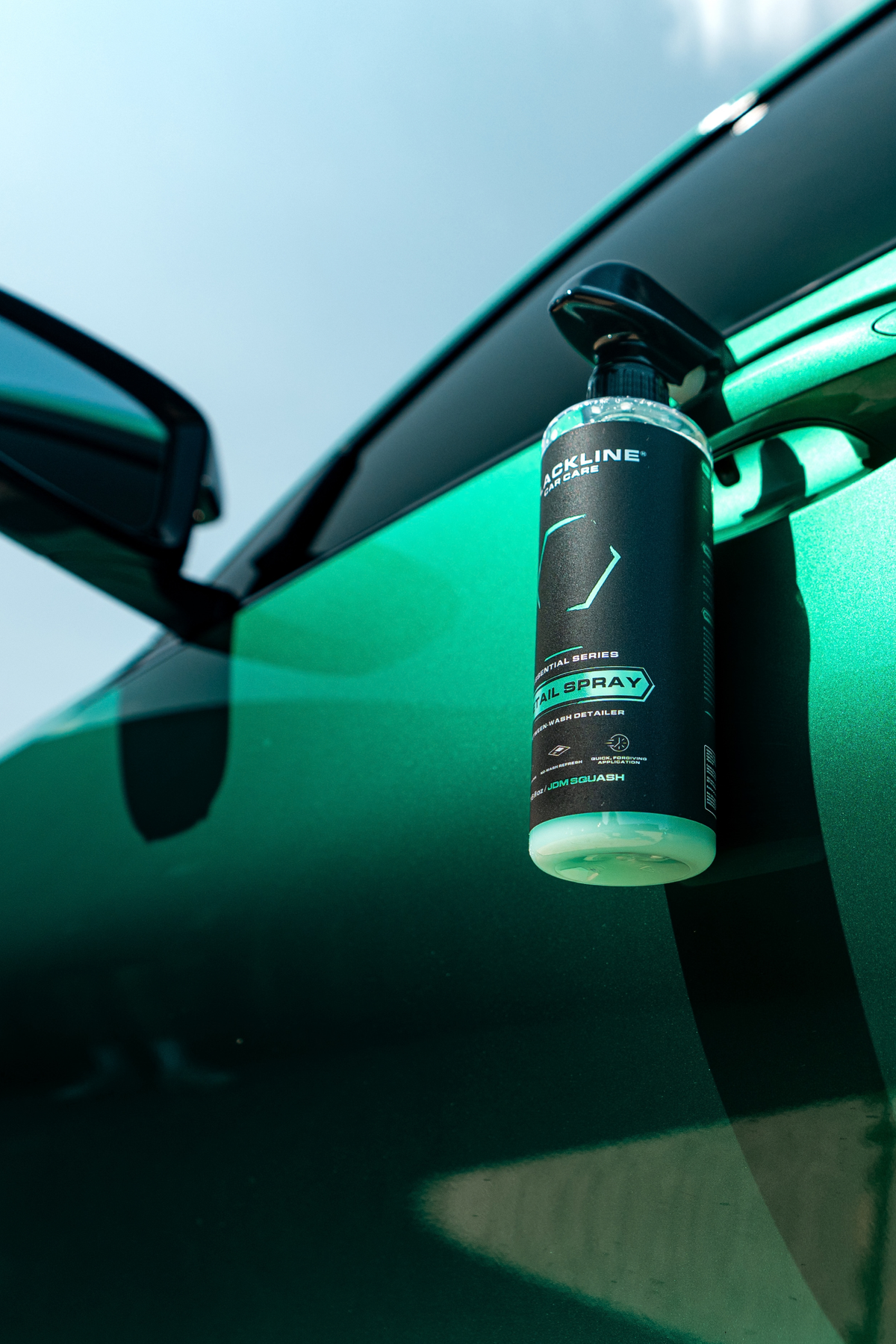 Blackline Detail Spray in action on a vehicle door during quick detailing session.