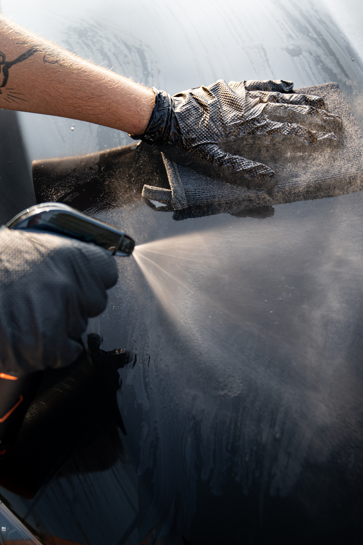 Blackline Clay Mitt microfiber decontamination mitt on a glossy painted car panel.