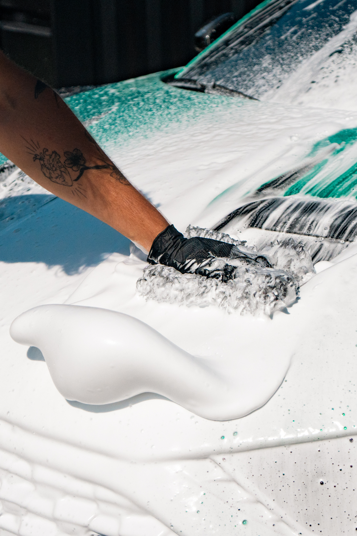 Blackline Complete Wash Kit in use during exterior car wash lifestyle shot