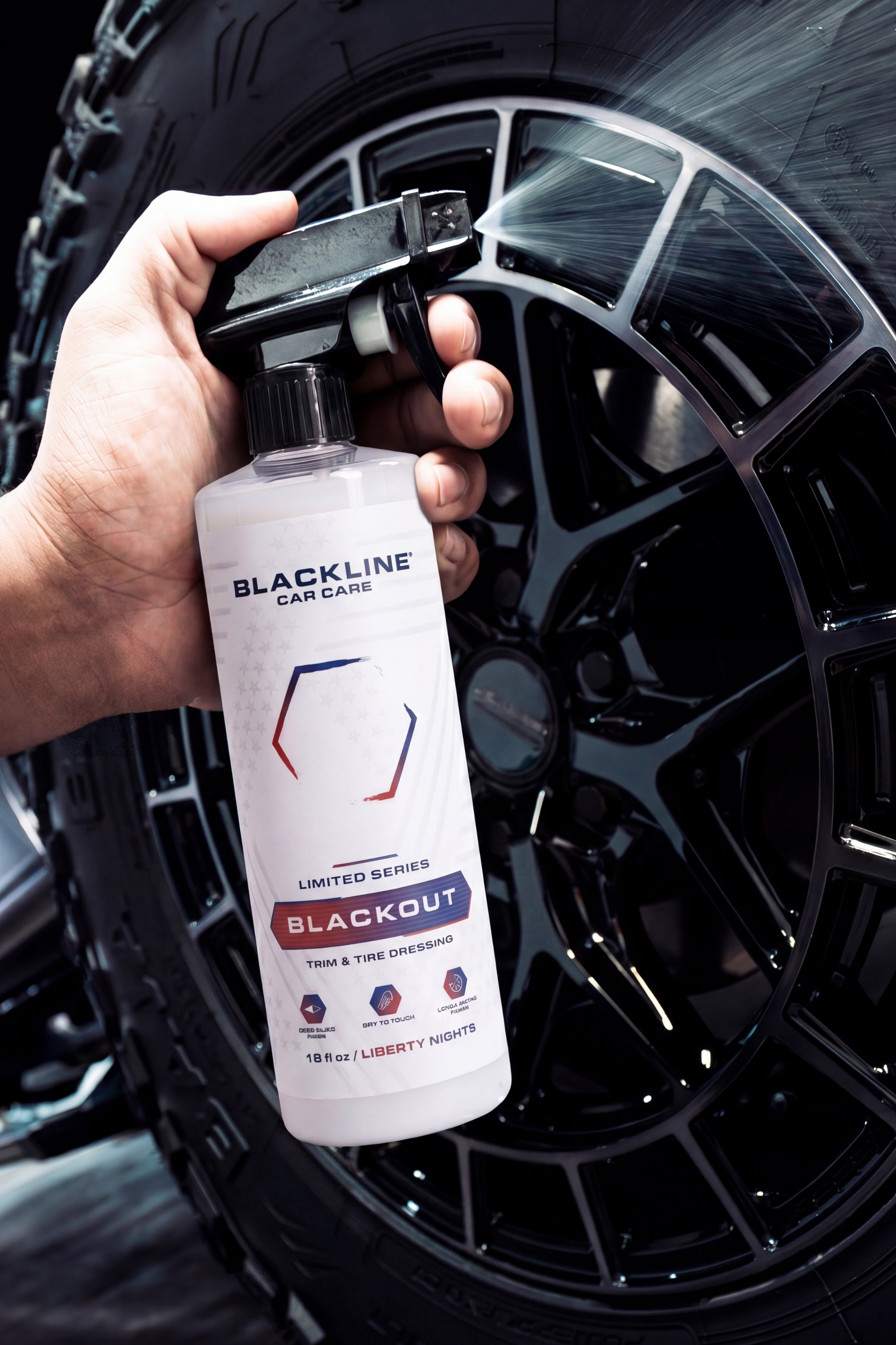 Glossy black tire showing deep-black finish after Blackline Blackout Tire Dressing treatment.