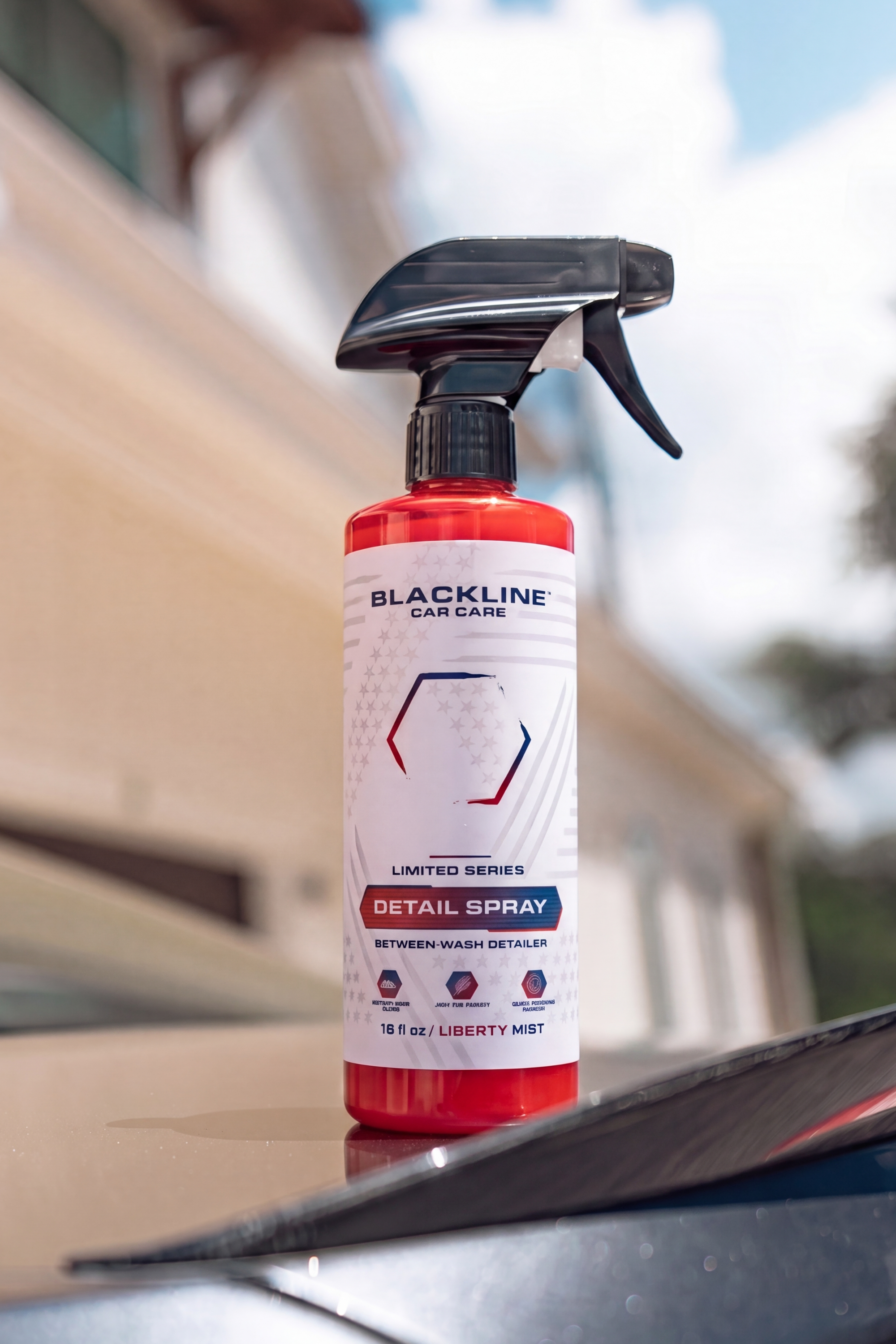 Blackline Liberty Mist Detail Spray being applied to a vehicle's painted exterior panel.