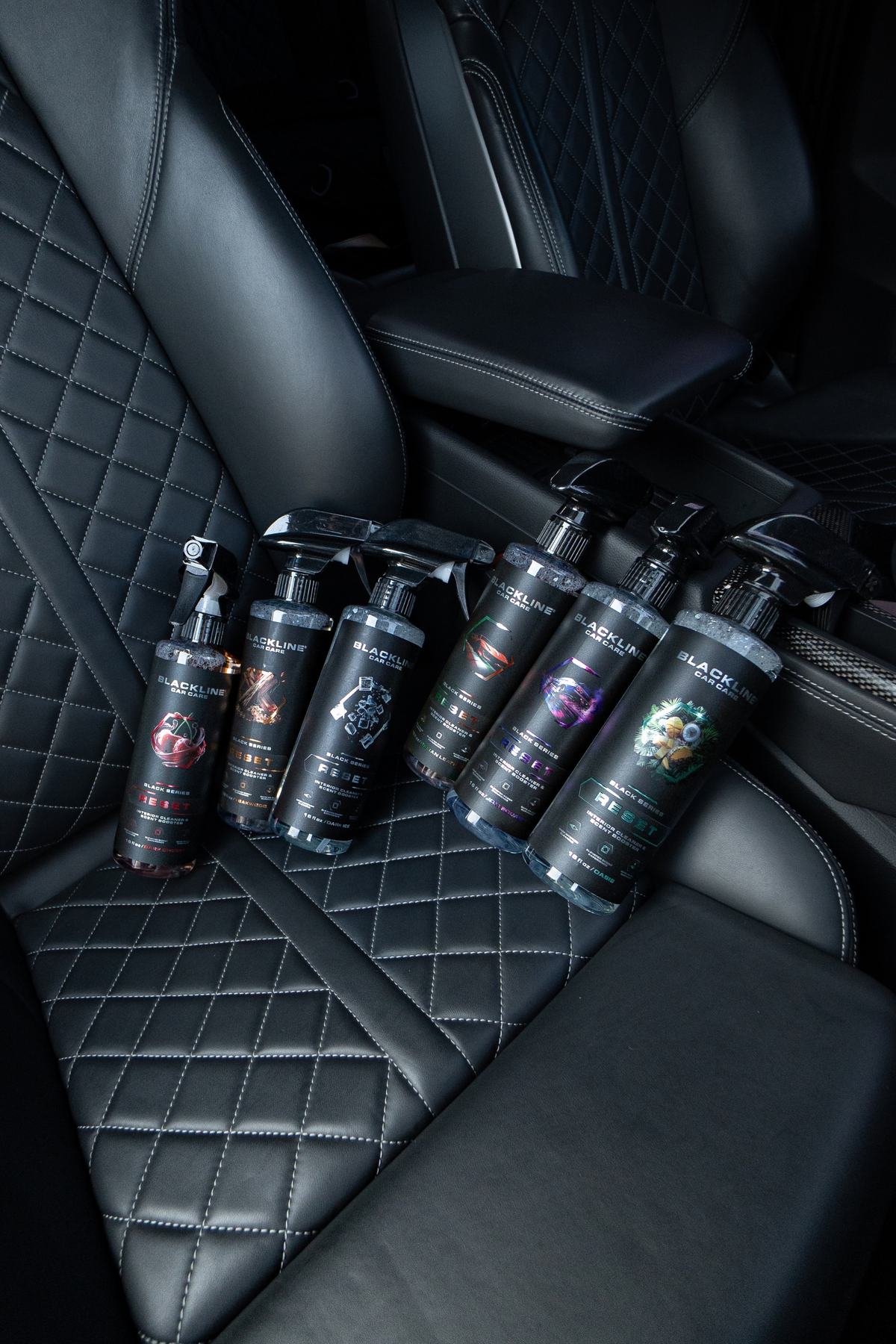 Blackline Reset scent-boosted interior cleaner being applied to car interior surface