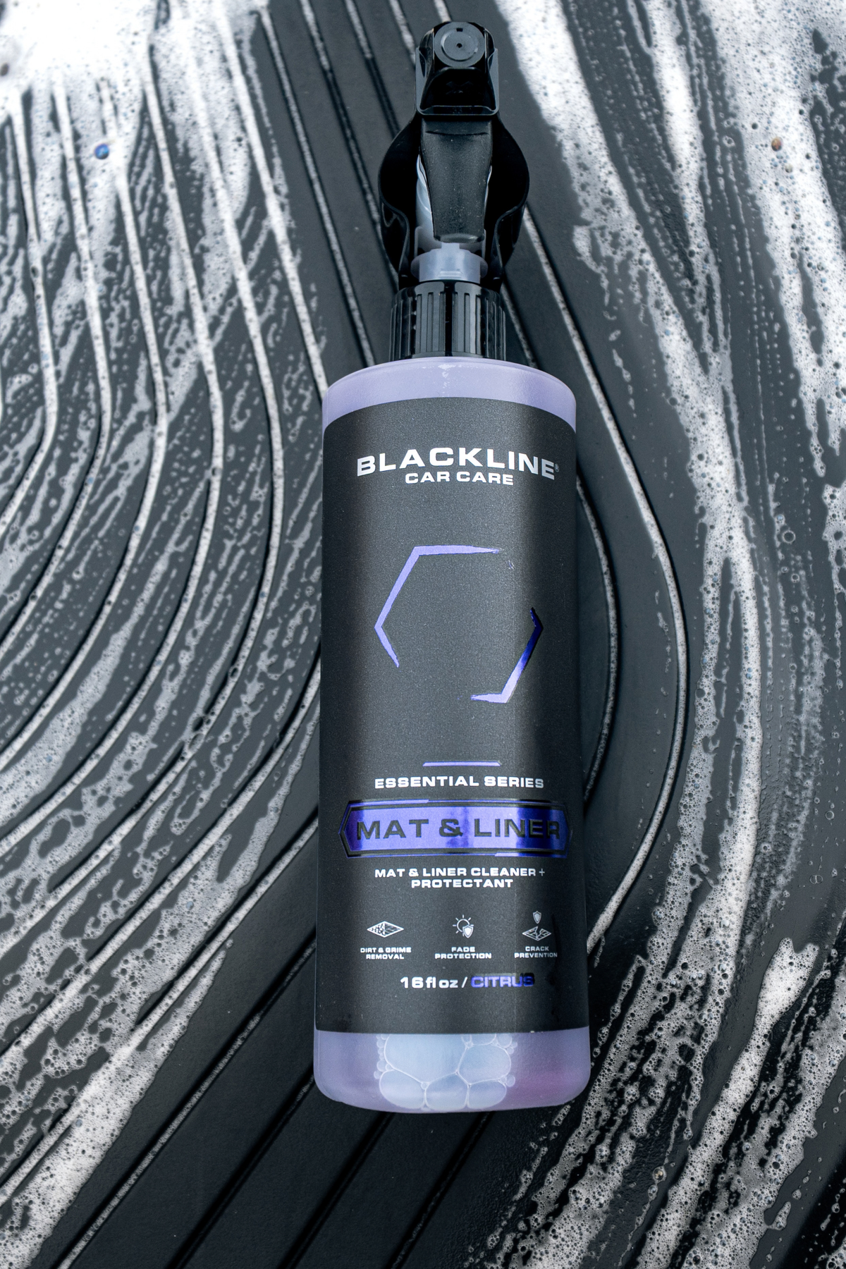 Floor mat fibers being deep cleaned by Blackline Mat and Liner solution close-up.