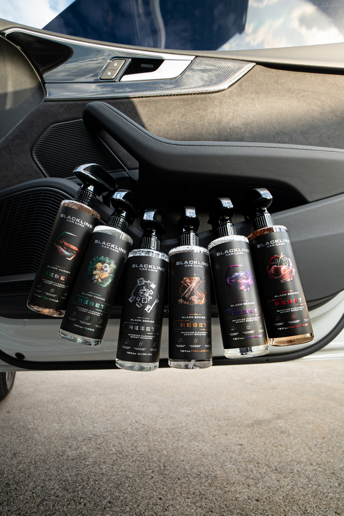 Multiple Blackline Reset scent-boosted interior cleaner variants displayed on dark background