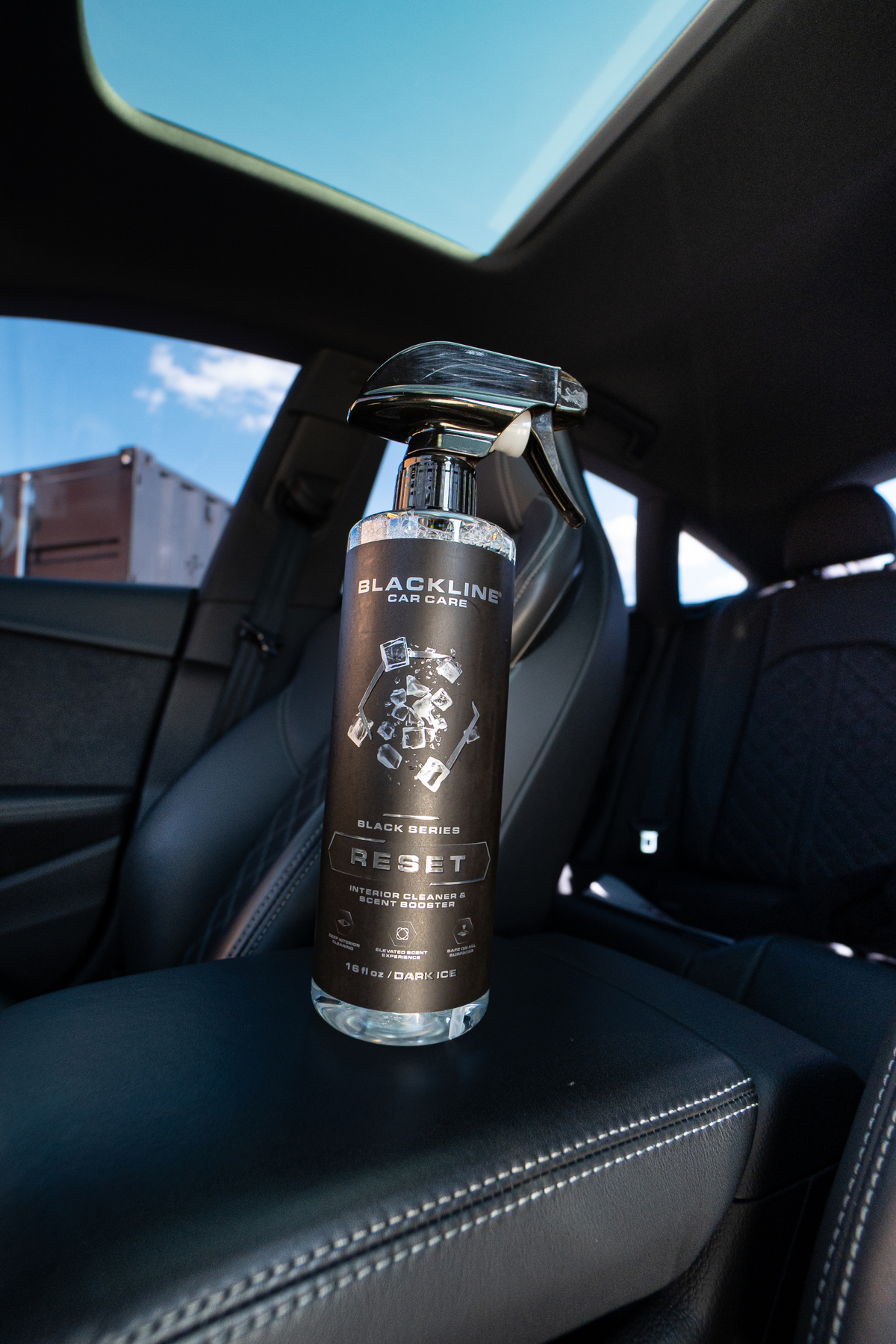 Blackline Reset interior cleaner in use on a car dashboard during detailing