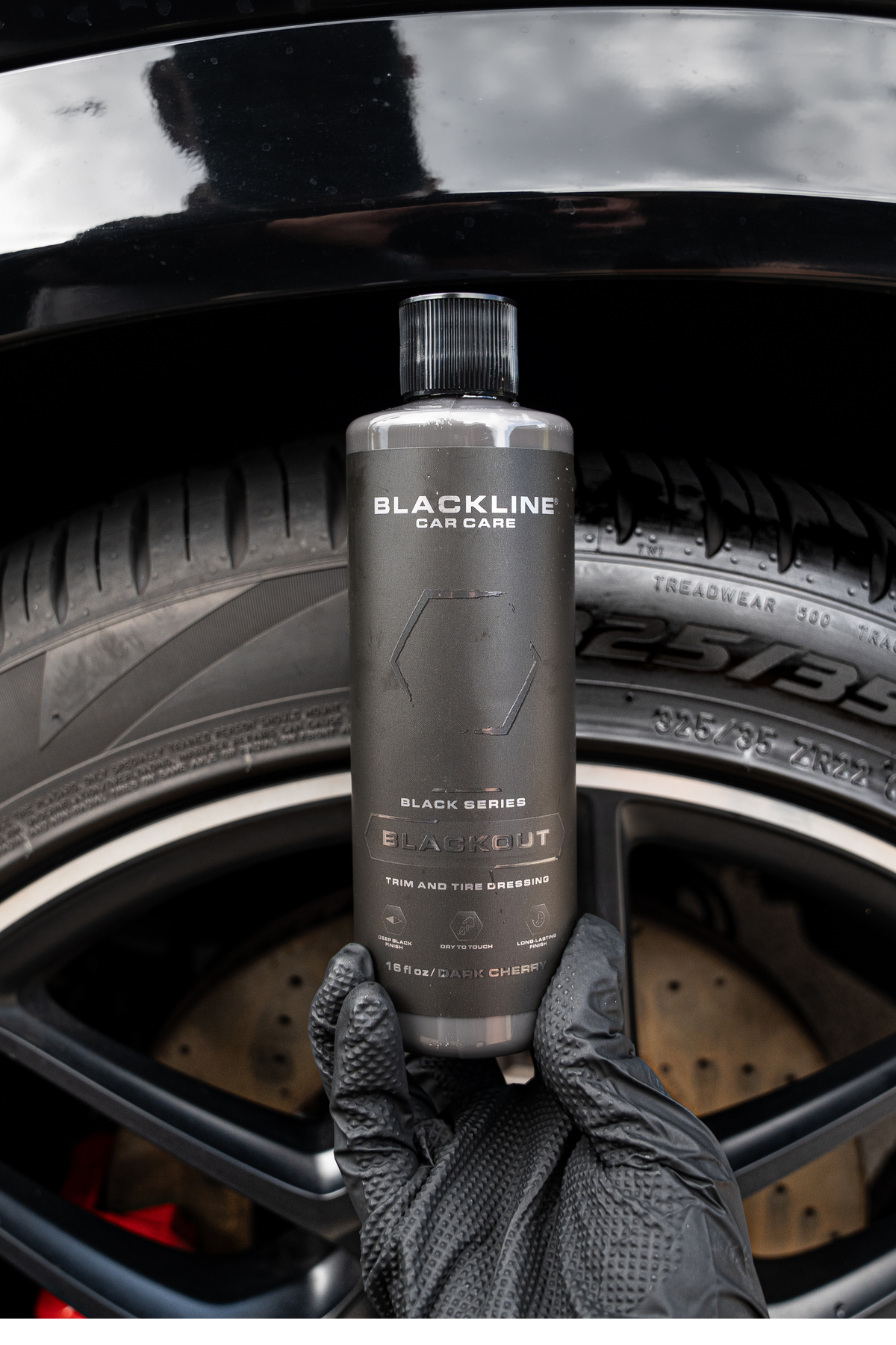 Blackline Blackout Trim and Tire Dressing bottle from the Blackout Vibes Bundle on dark surface