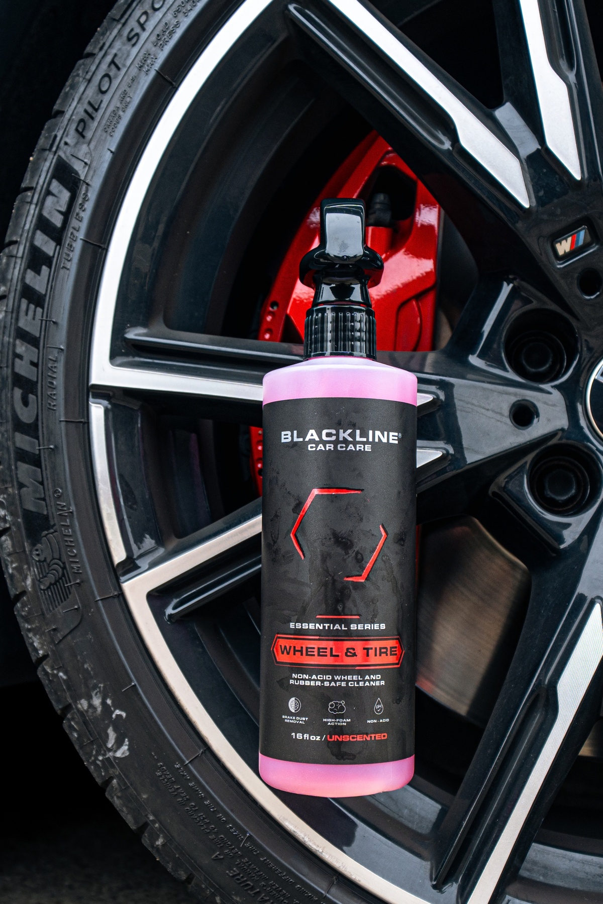 Gleaming wheel and tire after full treatment with Blackline Wheel and Tire cleaner.