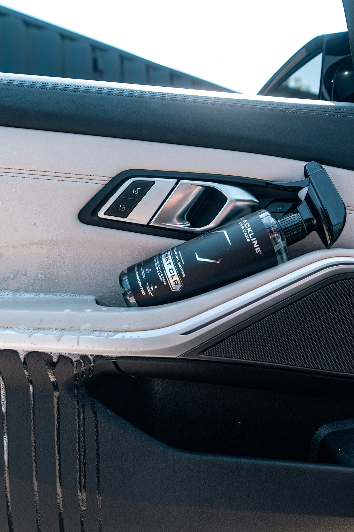Blackline Essential Series Reset CLR interior cleaner black spray bottle on dark background.