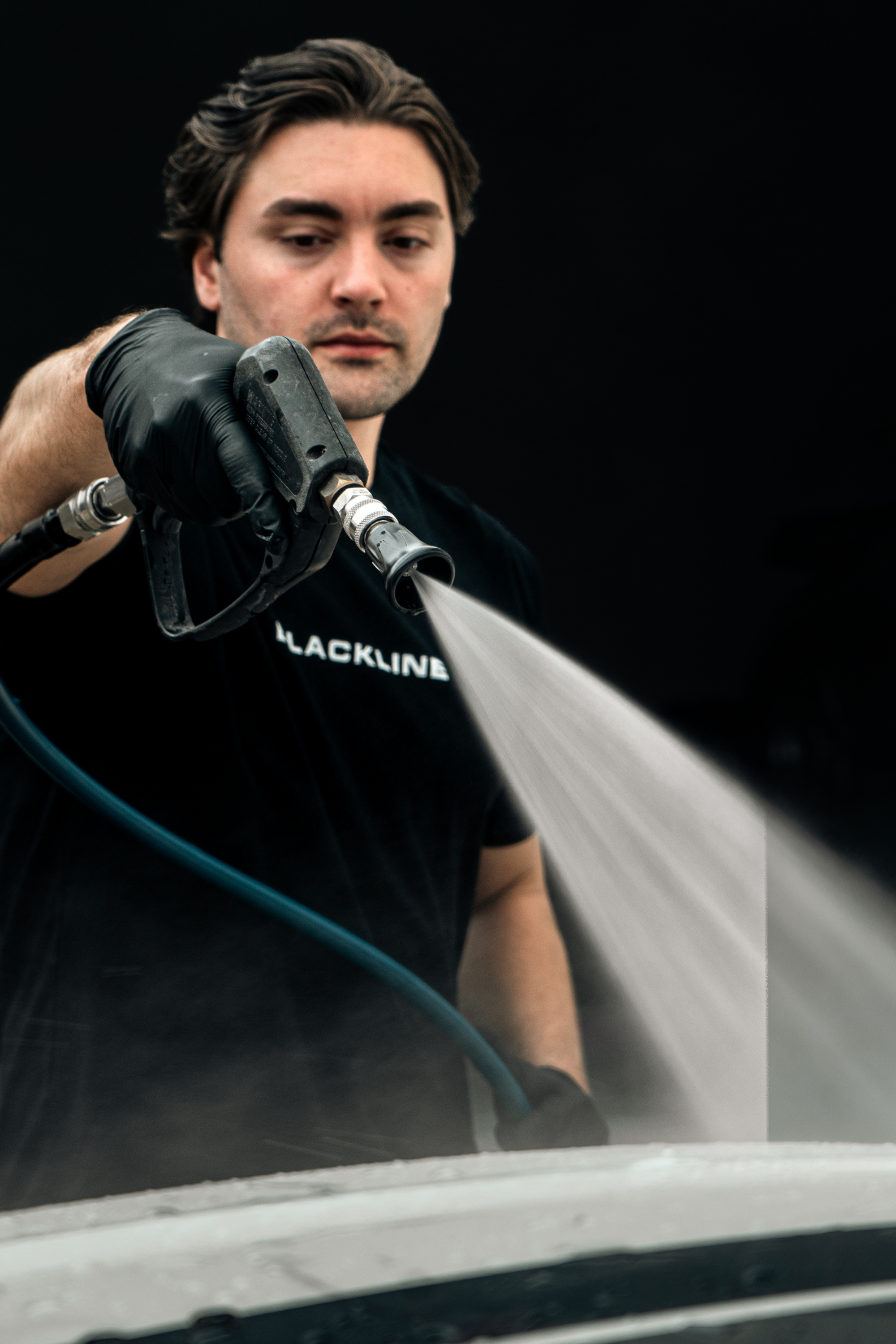 Blackline Flow Series pressure washer nozzle designed for controlled car-detailing rinses.