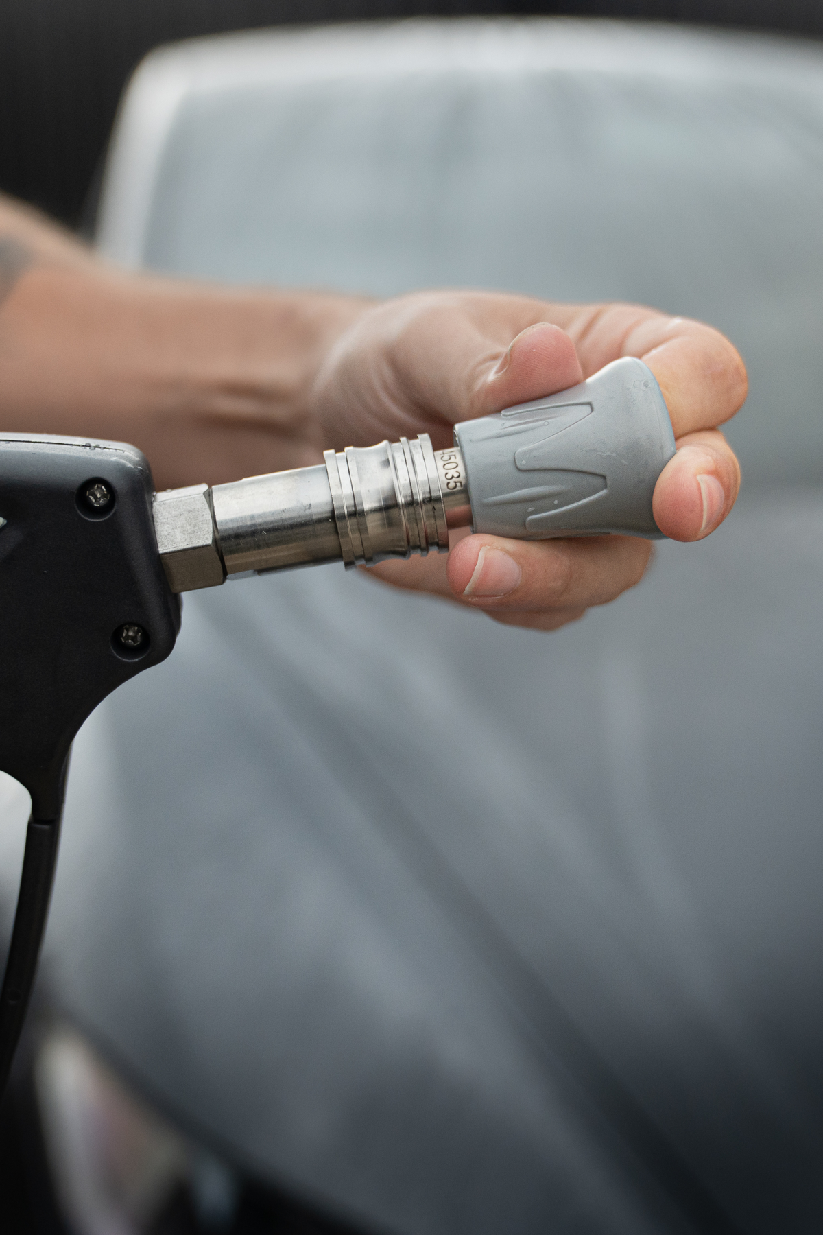 Blackline Flow Series 45-degree pressure washer nozzle, side angle view.