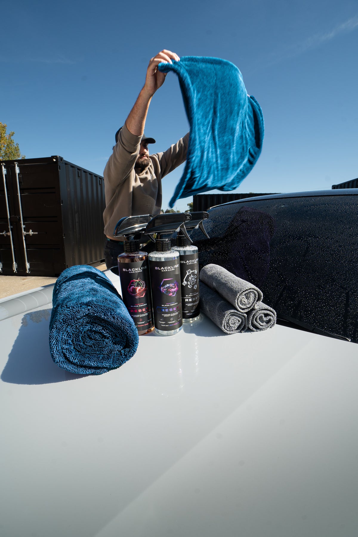 Blackline twisted-loop drying towel and Reset bundle on dark background, second angle