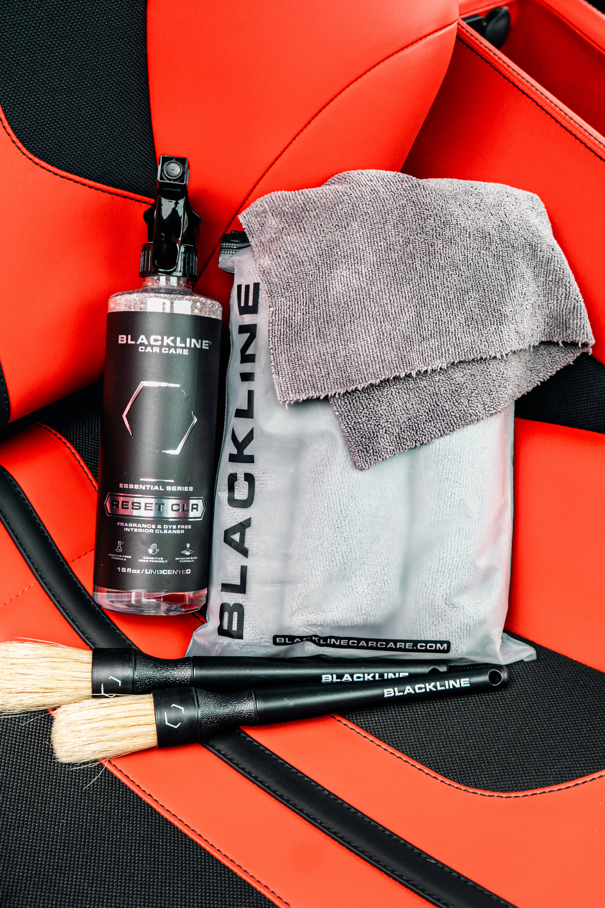 Blackline Reset interior cleaner with a folded microfiber towel