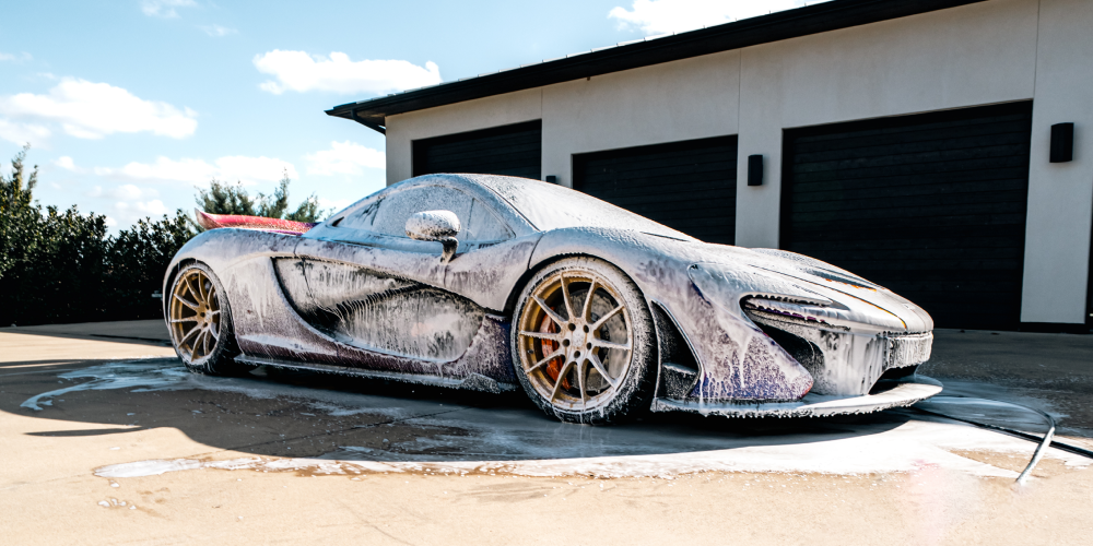 Glossy, defect-free car paint reflecting light, illustrating paint condition and resale value