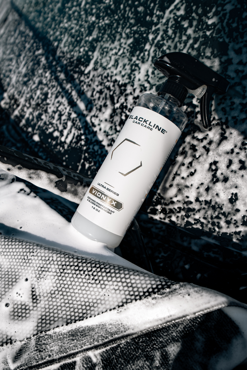 Blackline Vionyx ceramic protectant being misted onto vehicle paint.