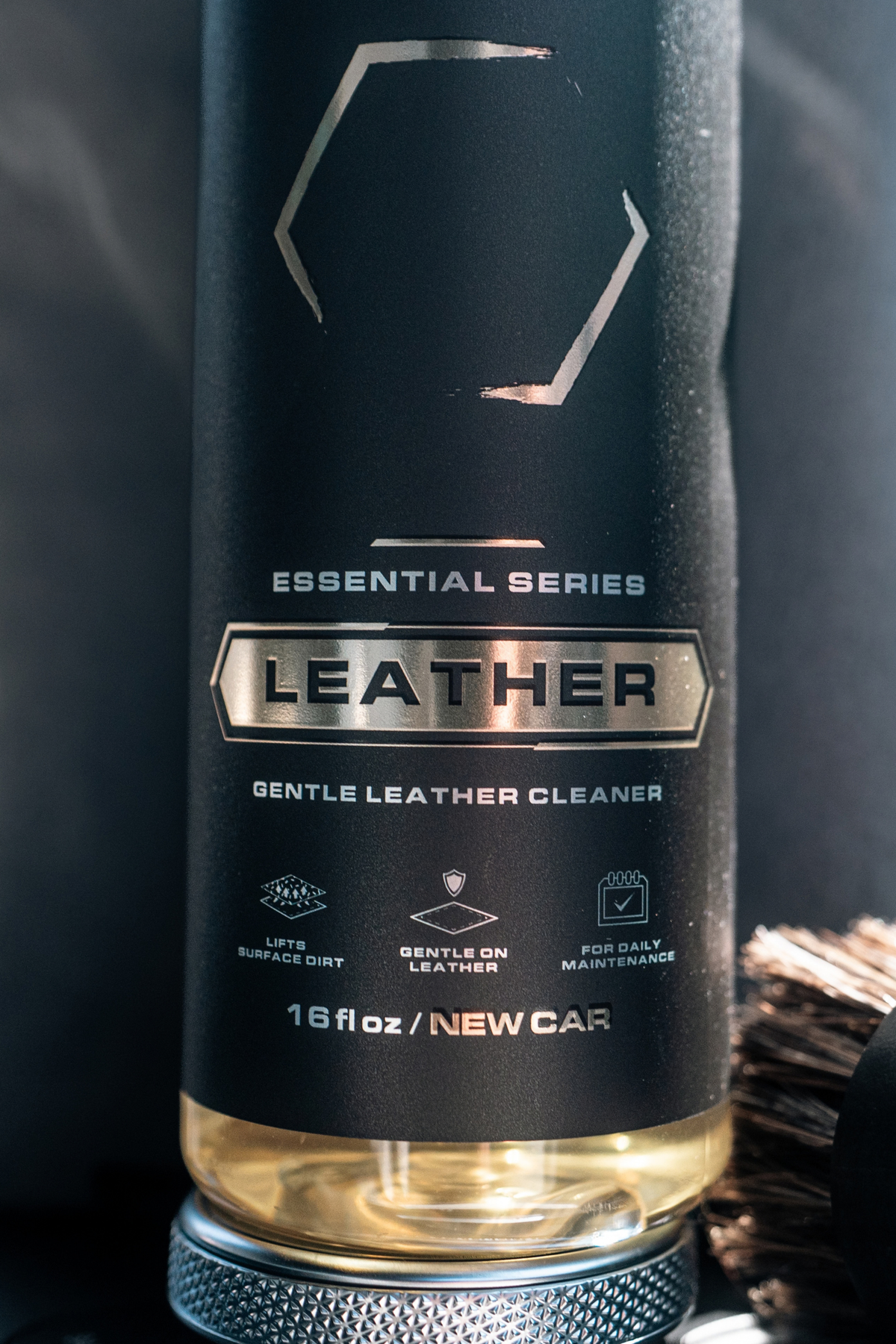 Blackline Leather conditioner nourishing and restoring a cracked leather armrest.