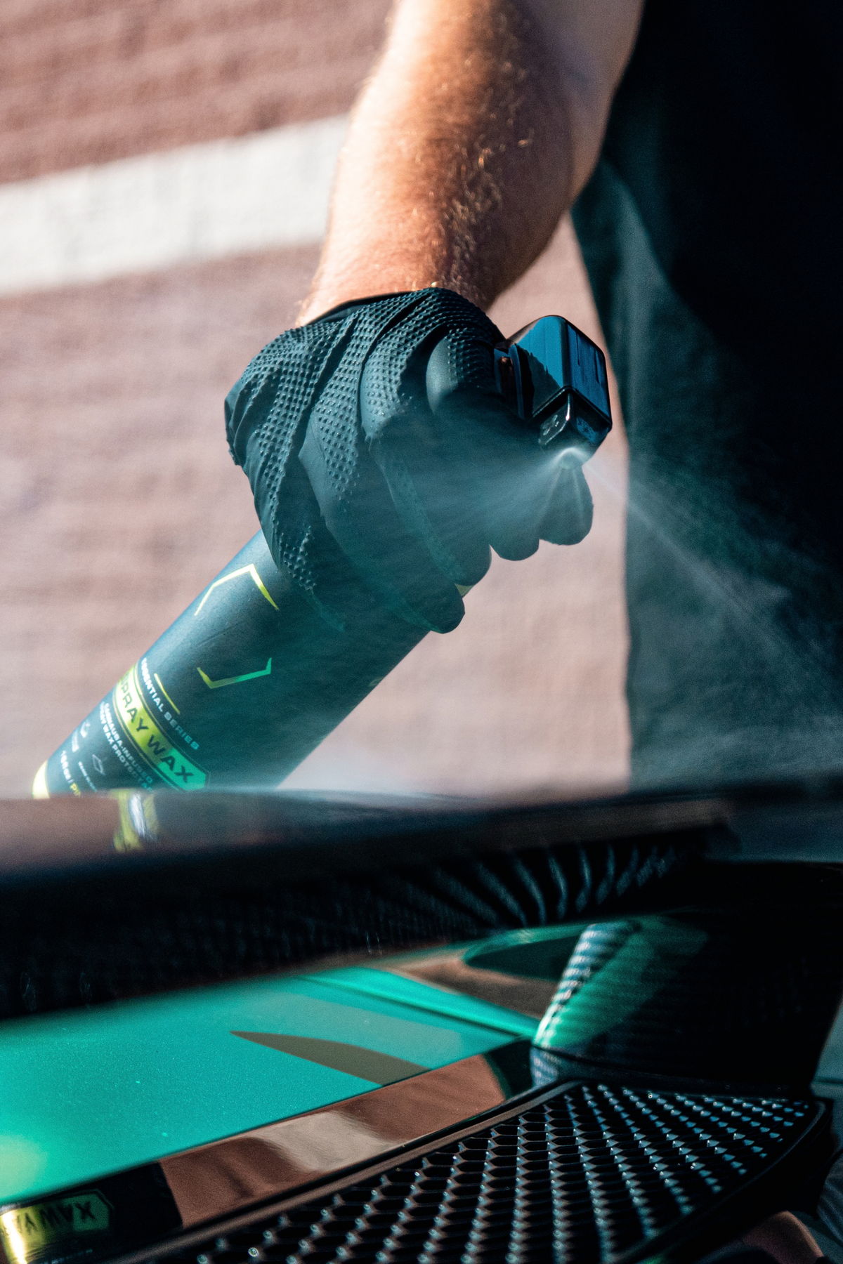Blackline Spray Wax applied to car paint using a foam applicator pad.