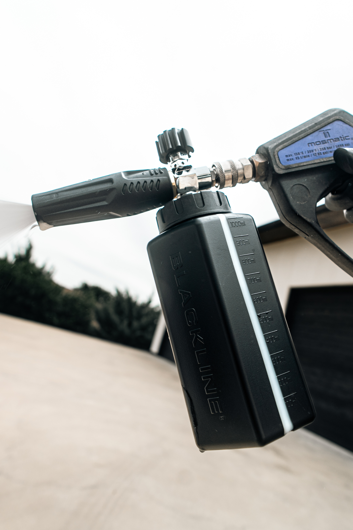 Blackline Foam Cannon Pro pressure washer attachment on dark background