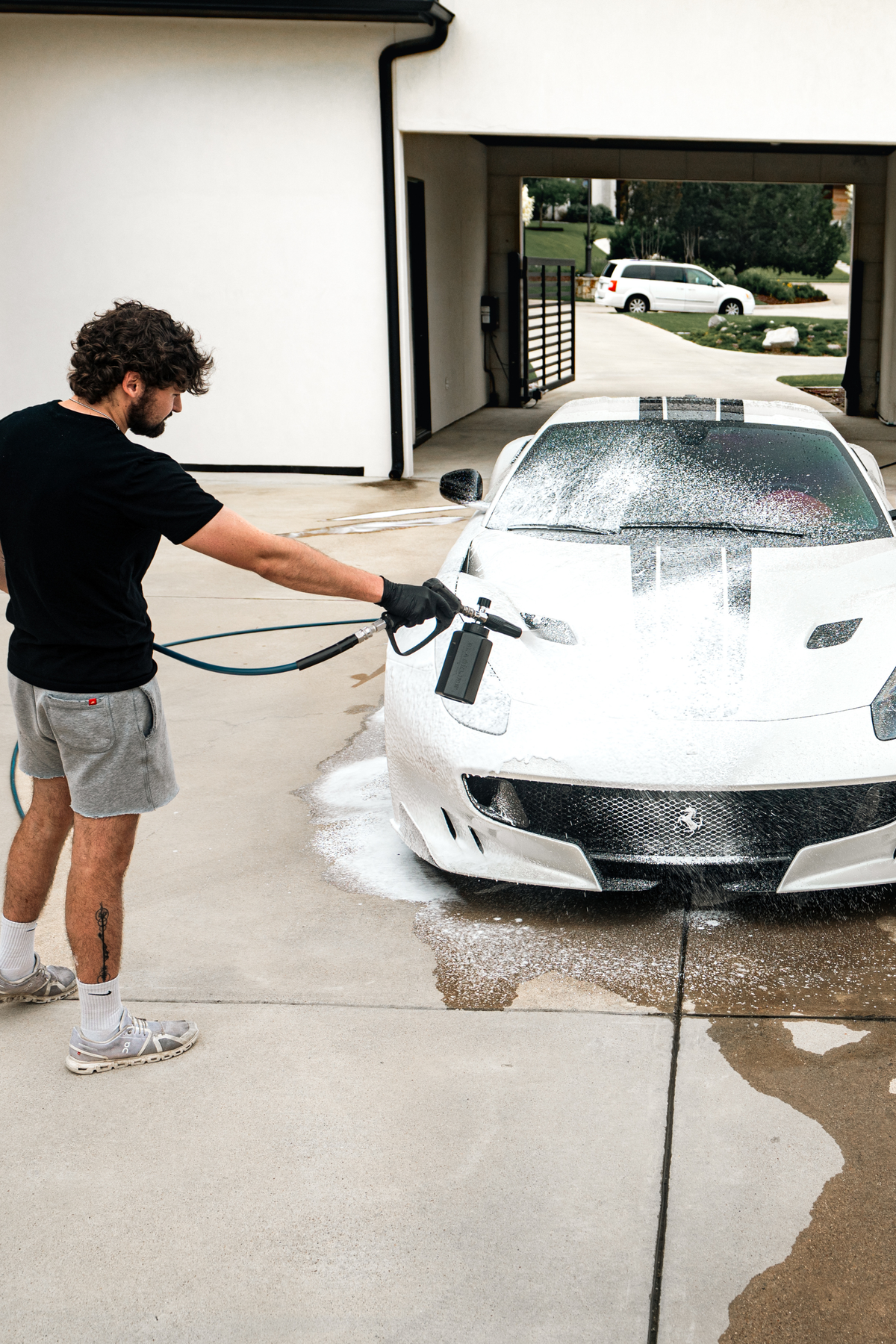 Blackline Foam Cannon Pro pressure washer attachment on dark background