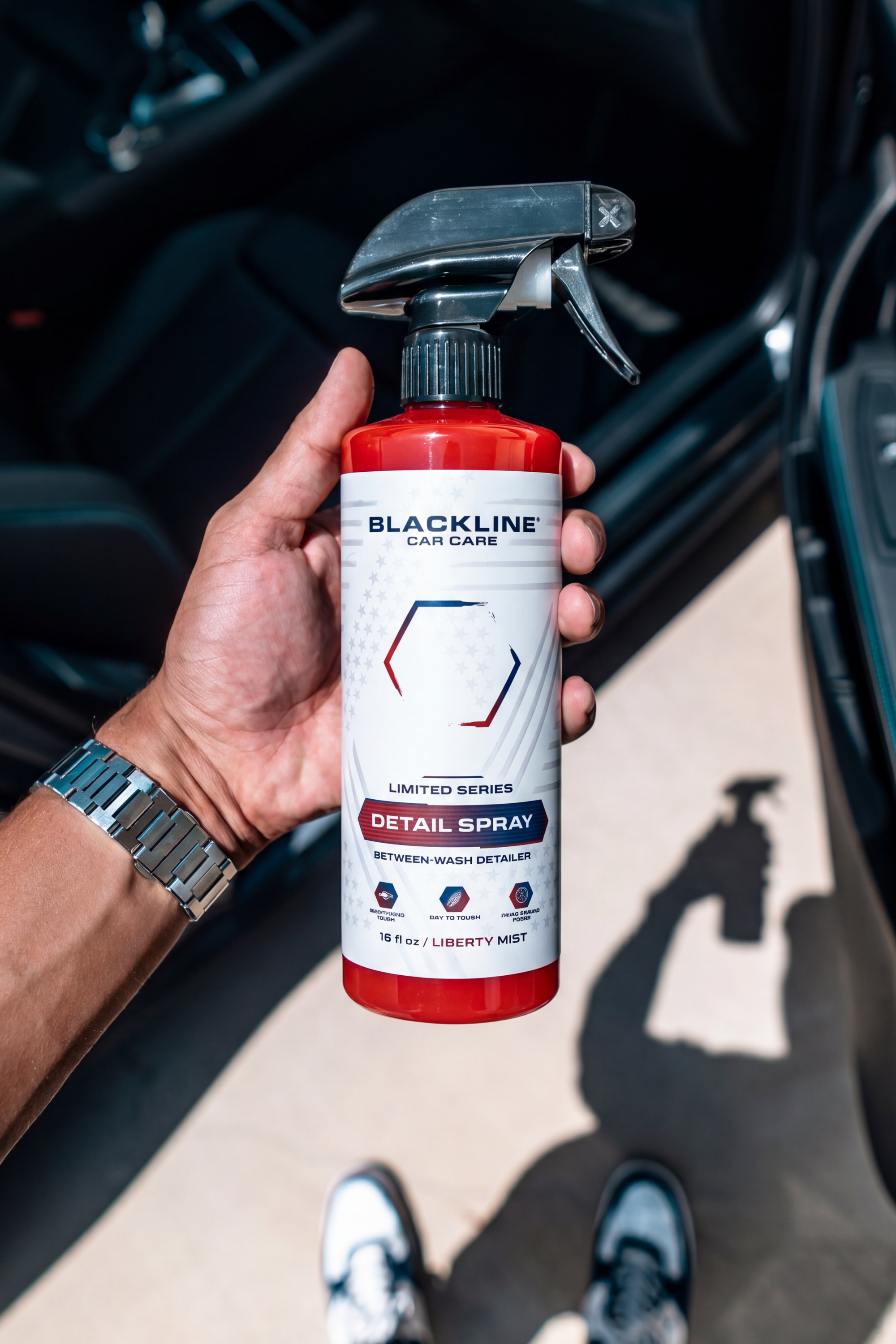 Blackline Liberty Mist Detail Spray wiped across glossy car paint with a microfiber towel.