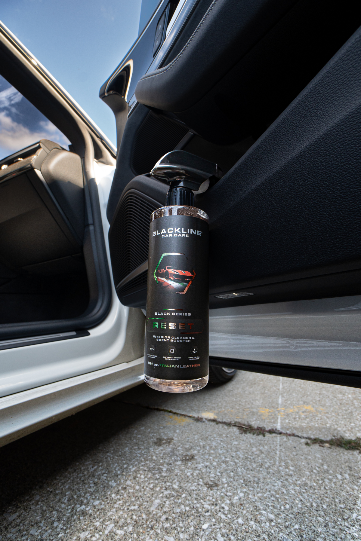 Blackline Reset interior cleaner spray bottle three-quarter view on dark background