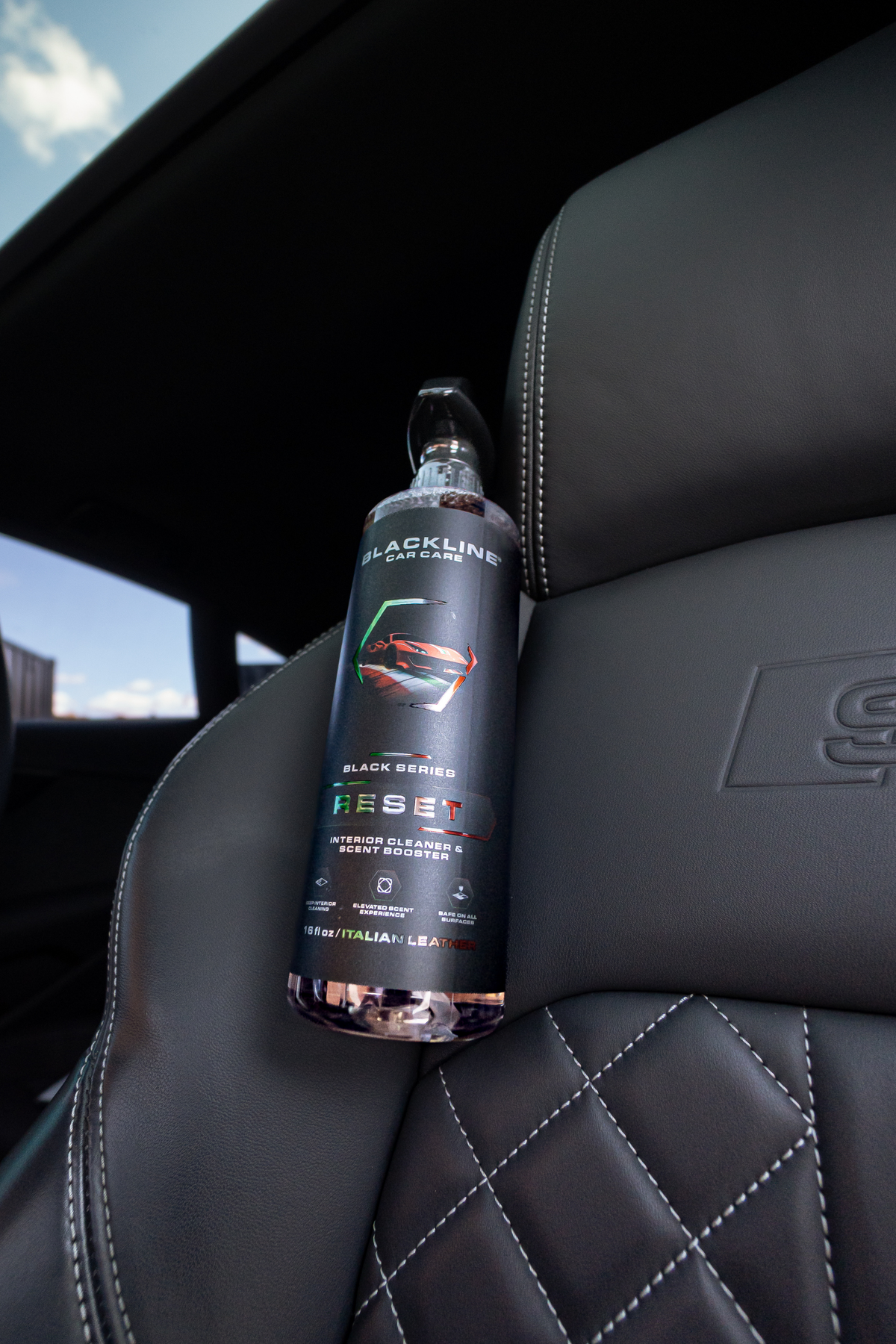 Blackline Reset scented interior cleaner in use inside a vehicle interior