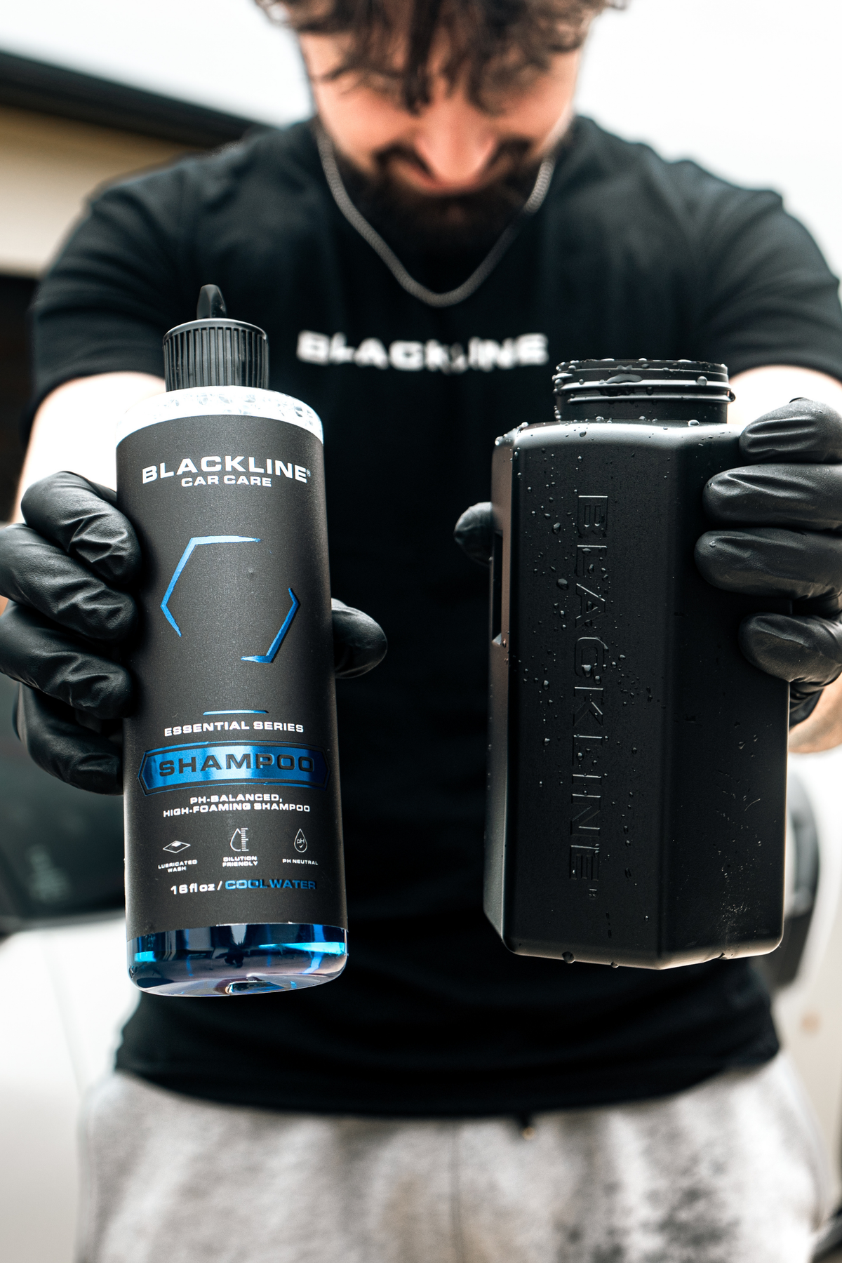 Rinsing Blackline Shampoo foam off a freshly washed vehicle.