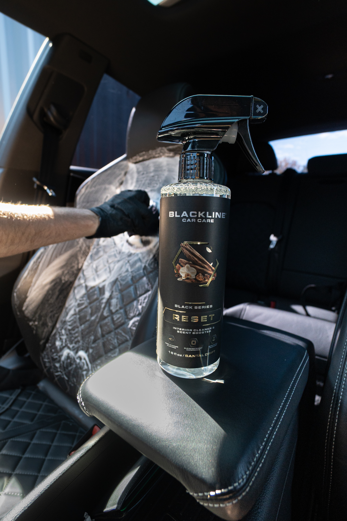 Blackline Reset Interior Cleaner spray bottle top-down view on dark background