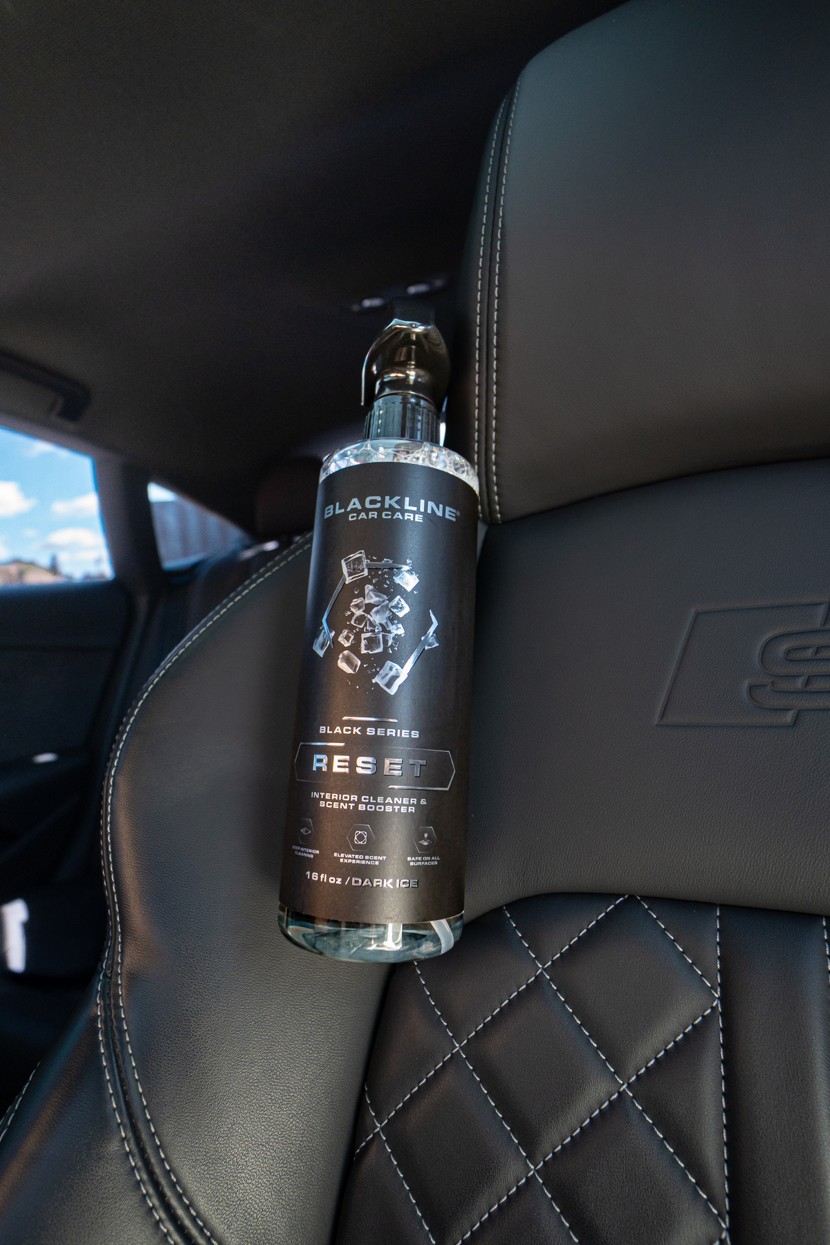 Blackline Reset interior cleaner Black Series spray bottle on dark background