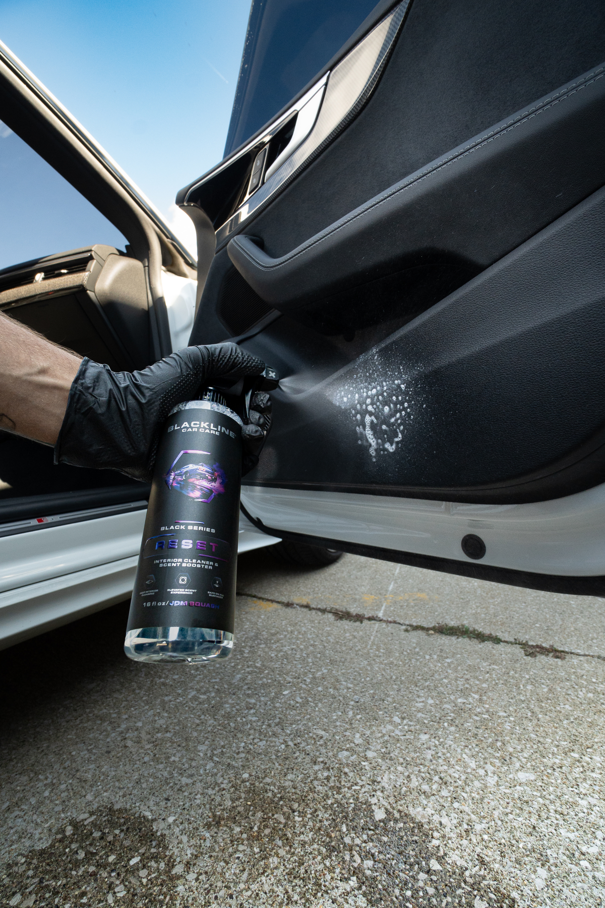 Blackline Reset scented interior cleaner spray bottle front view on dark background