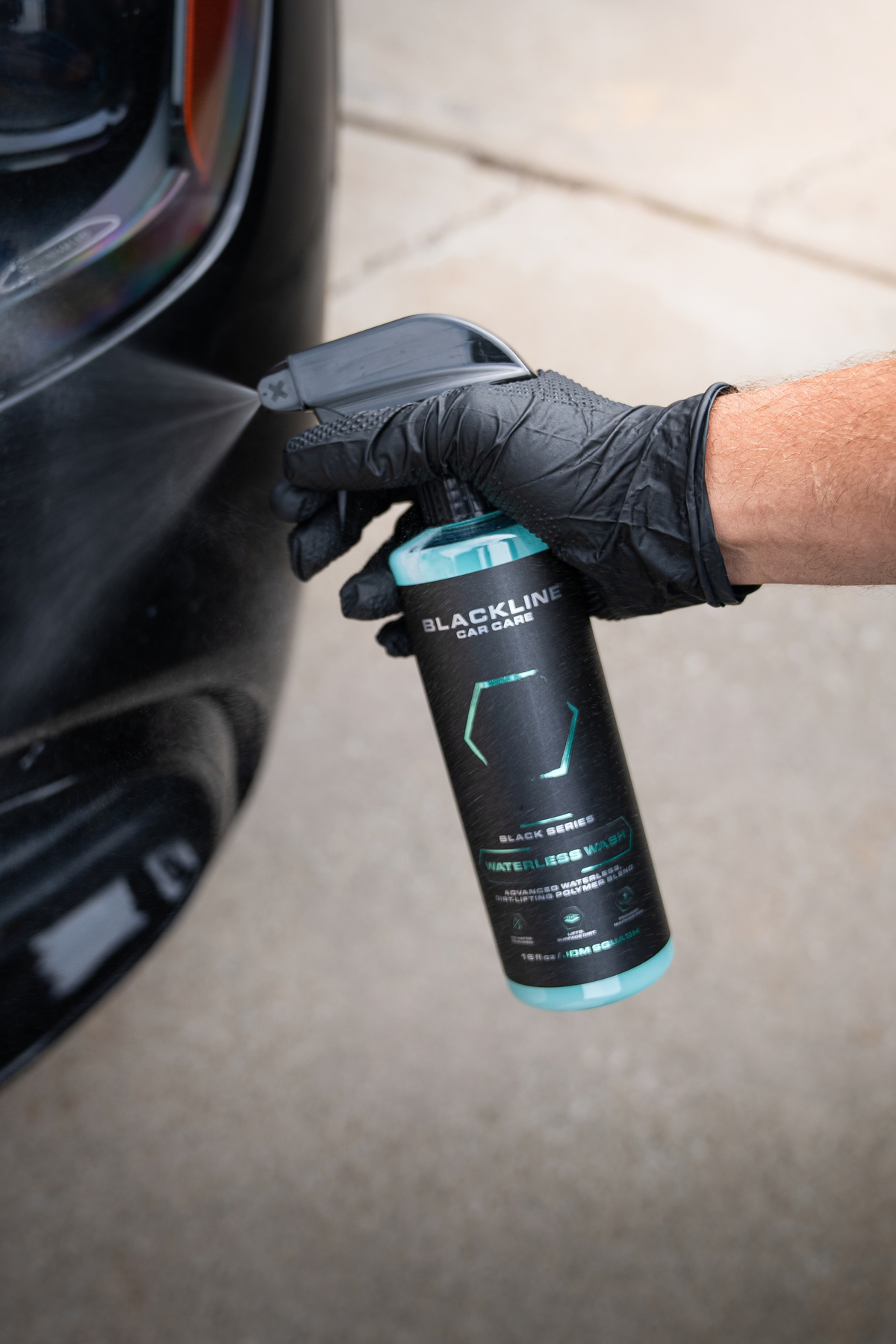 Blackline Reset interior cleaner spray bottle side view on dark background