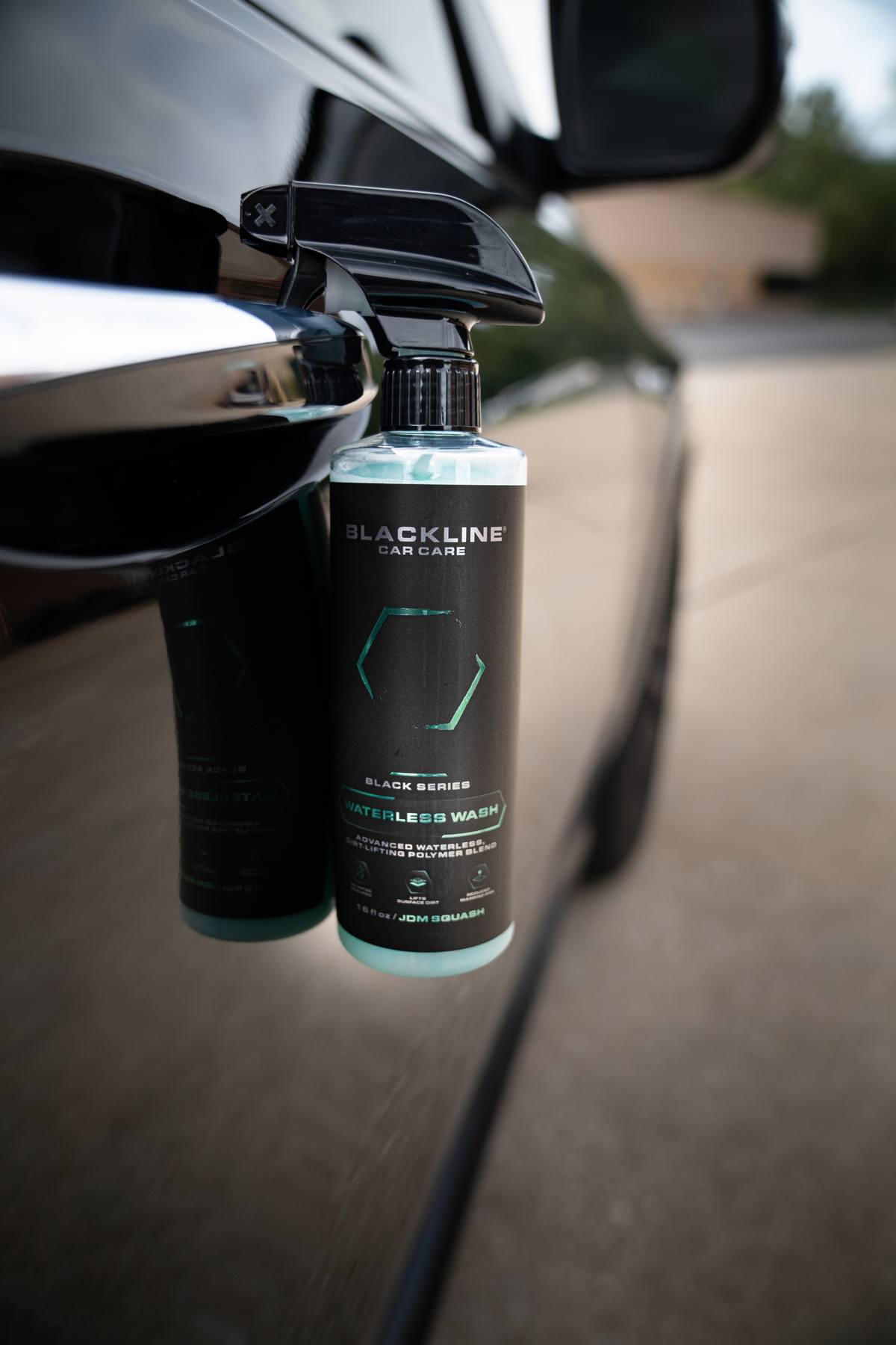 Blackline Reset scent-boosted interior cleaner being sprayed on car seat upholstery