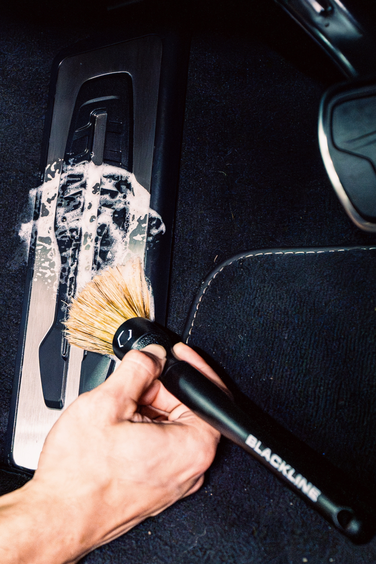 Blackline Boar's Hair Brush Set in use detailing a car interior