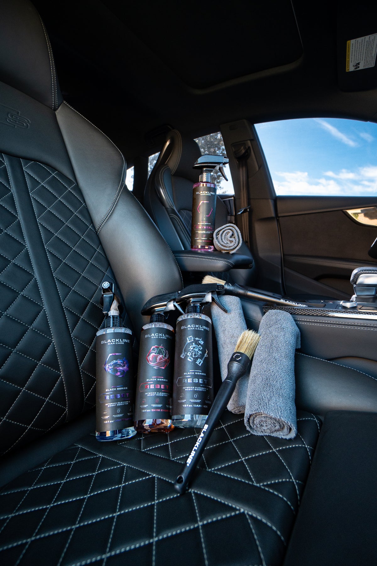 Blackline Reset Bold scented interior cleaner spray bottle on dark background
