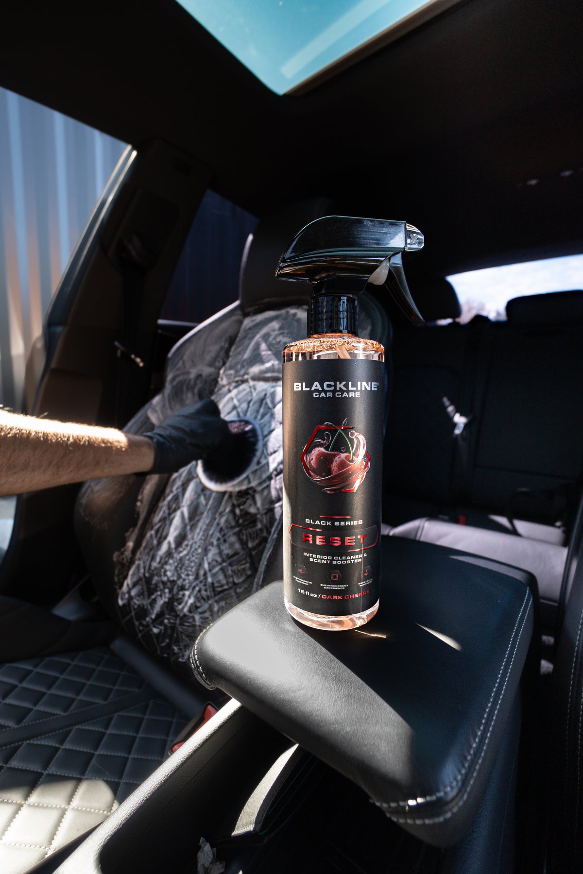 Close-up of Blackline microfiber drying towel on a wet vehicle surface