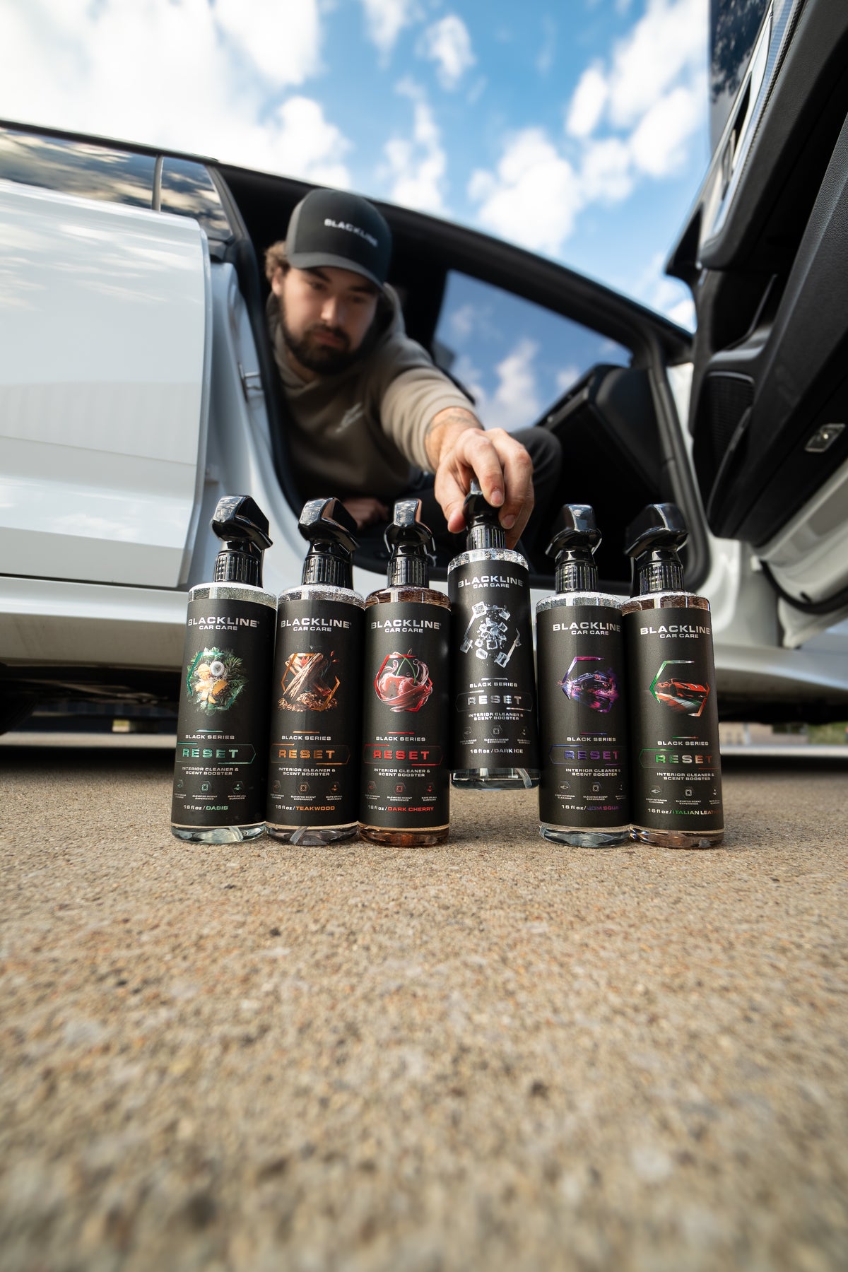 Blackline Reset scent-boosted interior cleaner 3-pack Vibes bundle on dark surface