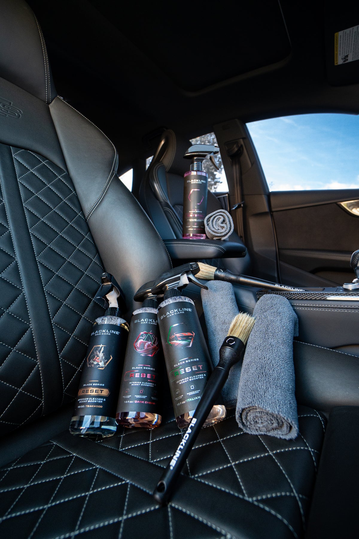 Blackline Reset Rich scented interior cleaner spray bottle on dark background